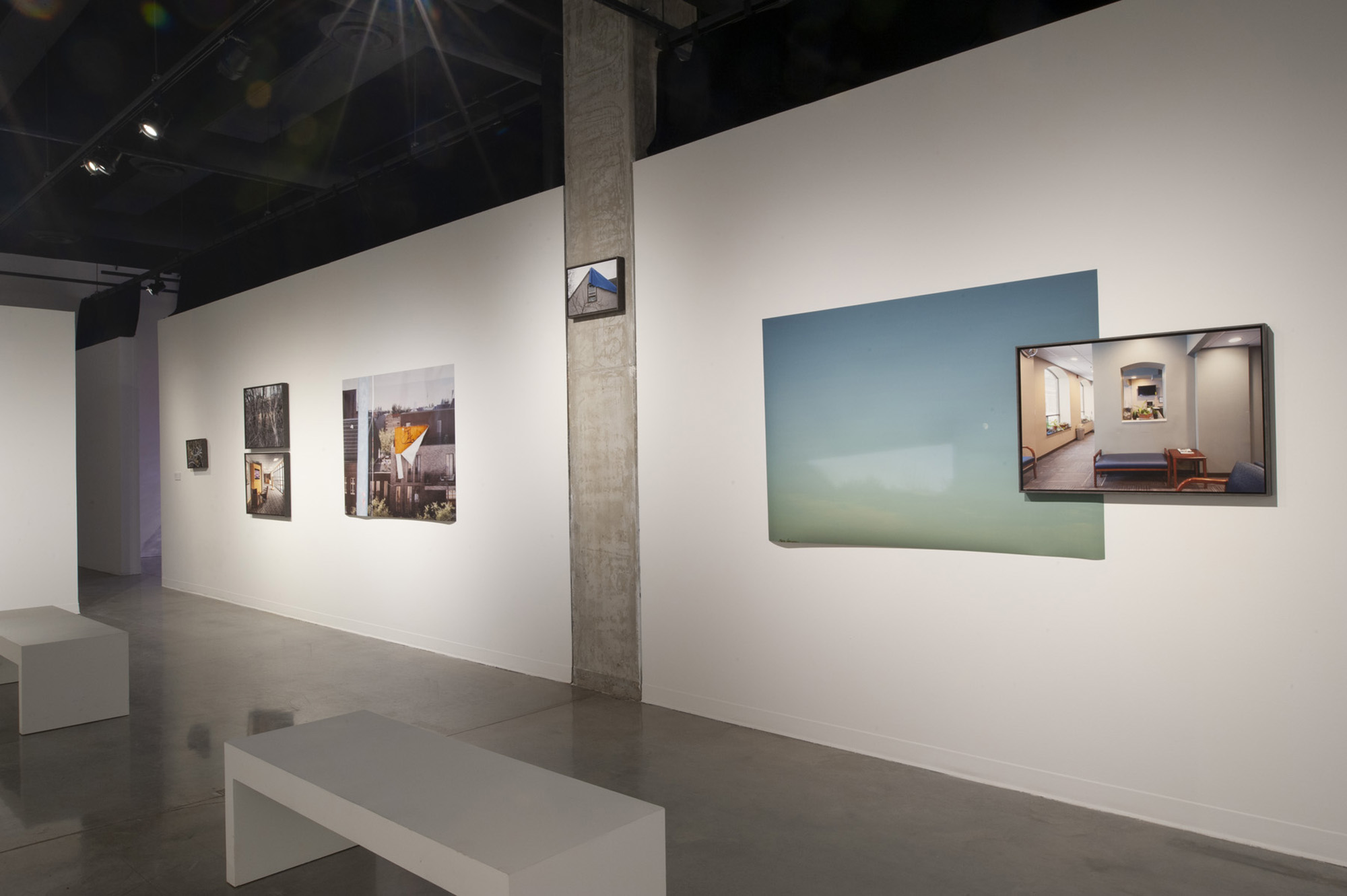 Image of photographs on a gallery wall
