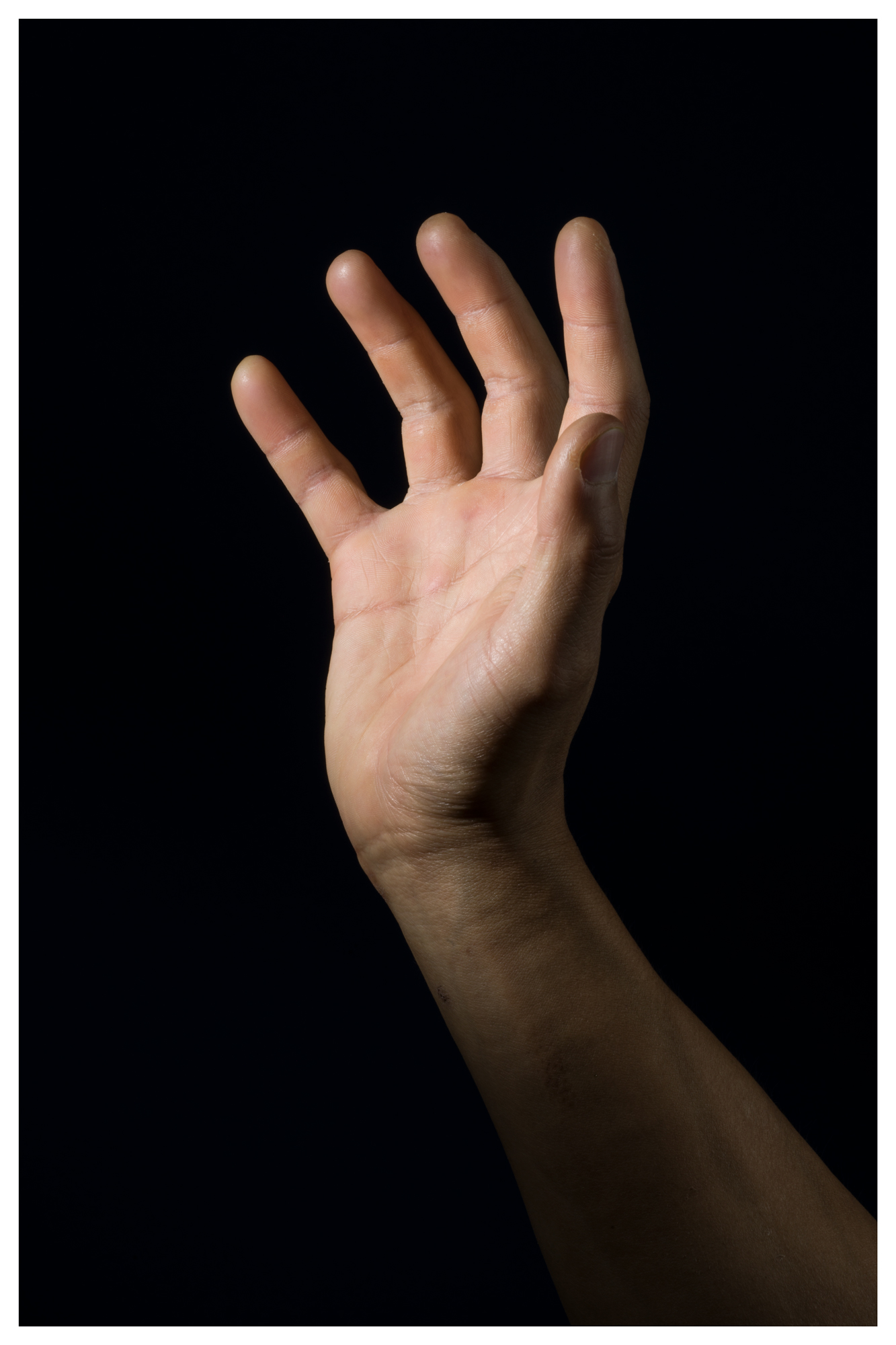 Photo of a hand on a black background