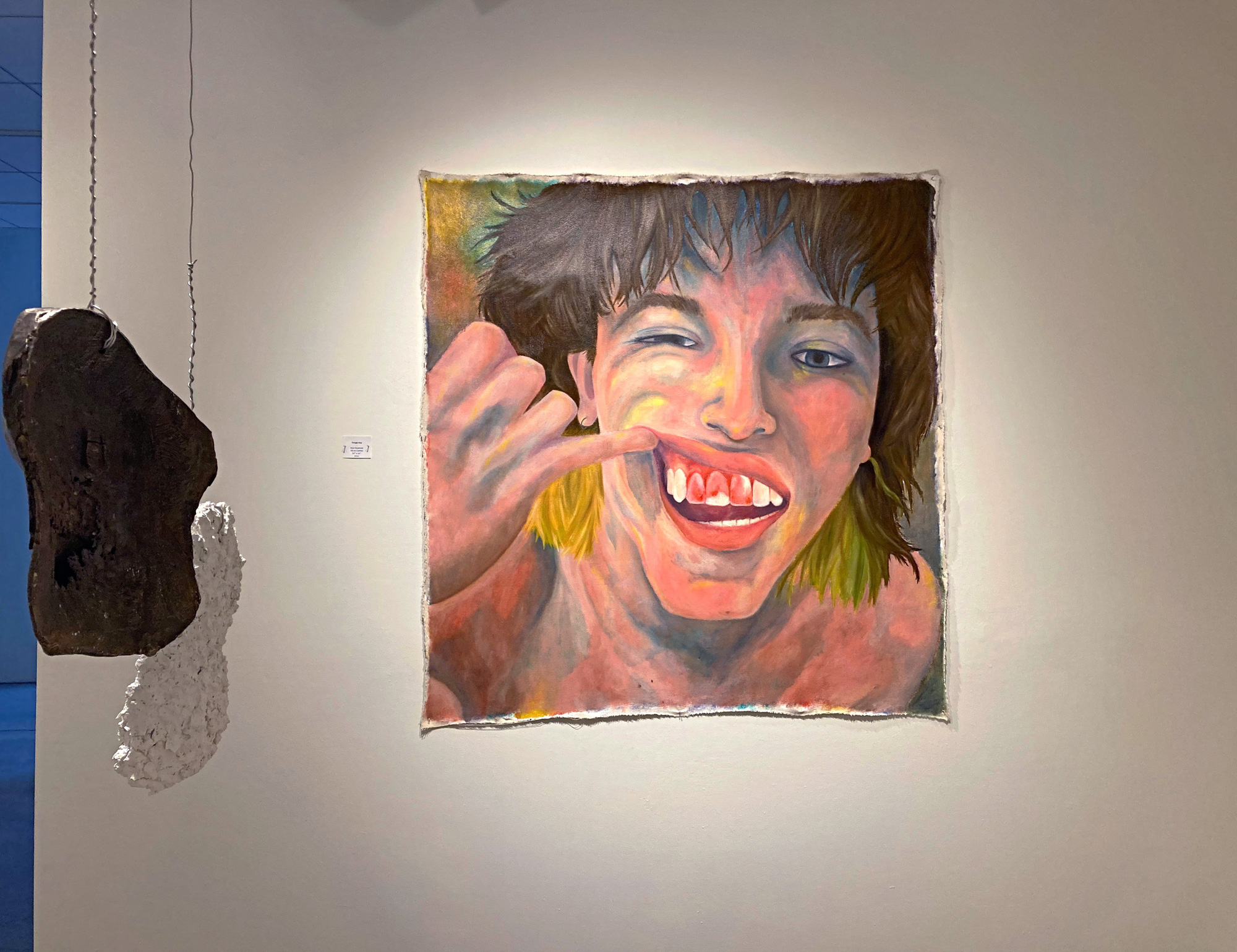 Painting of a portrait of a person showing their teeth