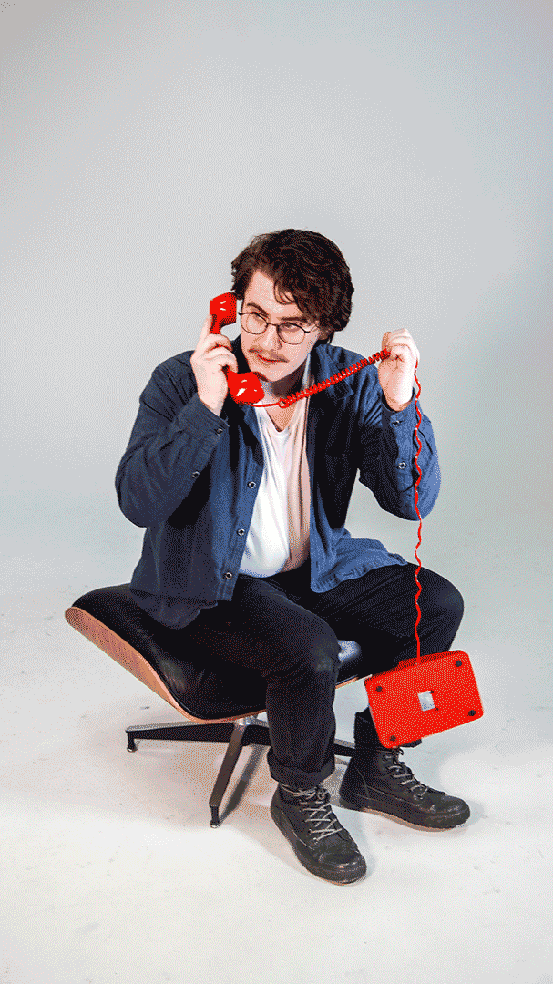 Gif of person on a red corded phone