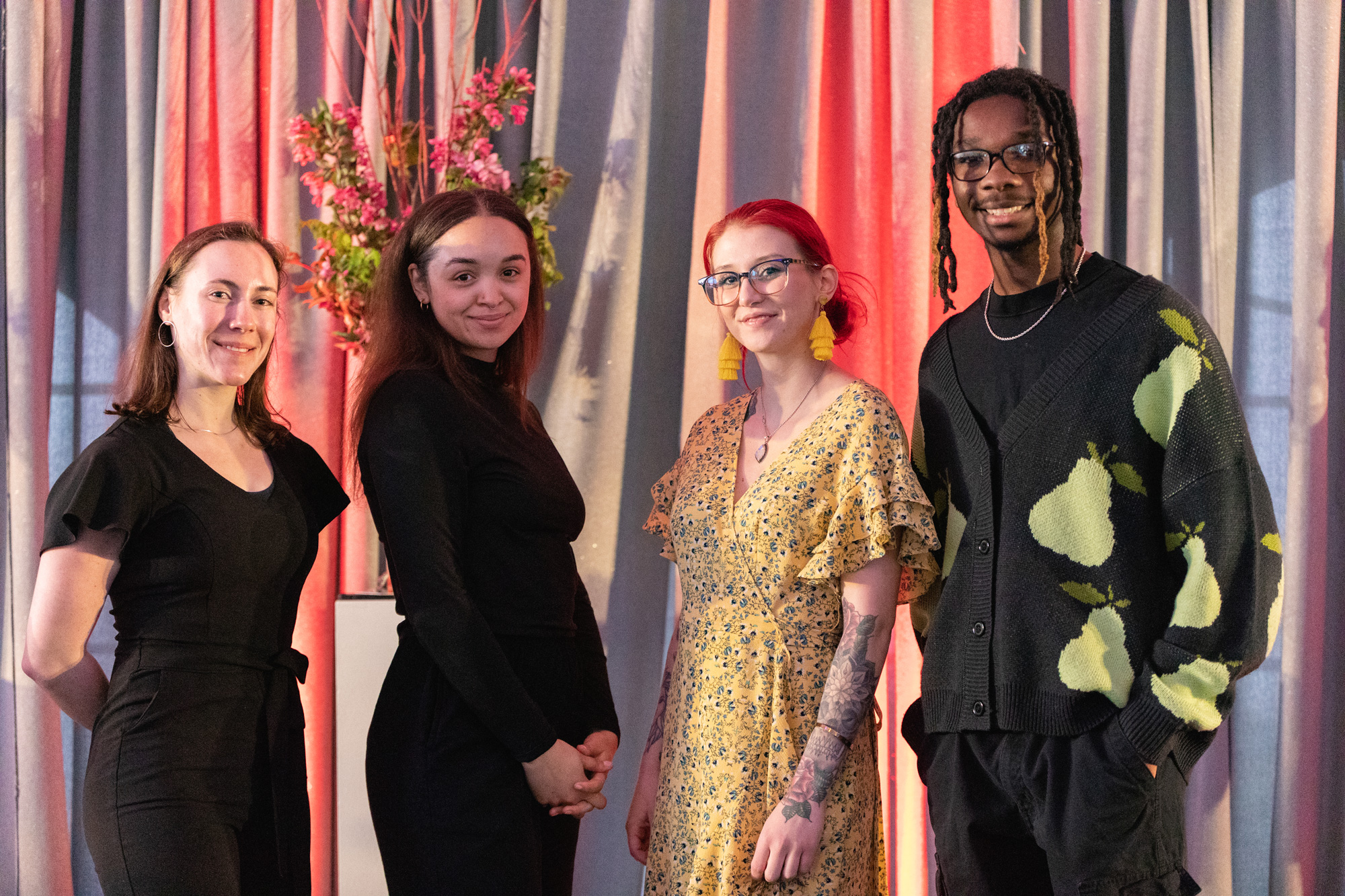 A group of people smiling during the MCAD Auction