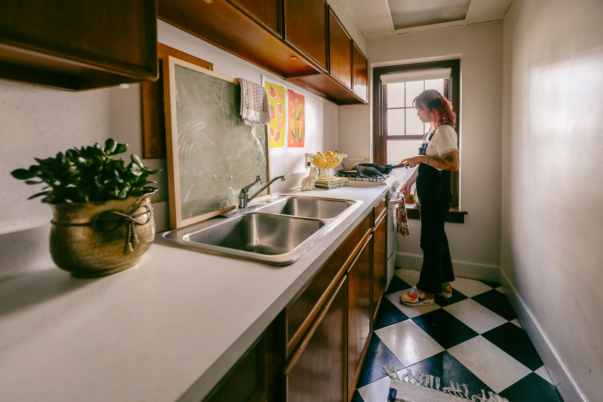 Student cooking in the kitchen of a 2550 apartment
