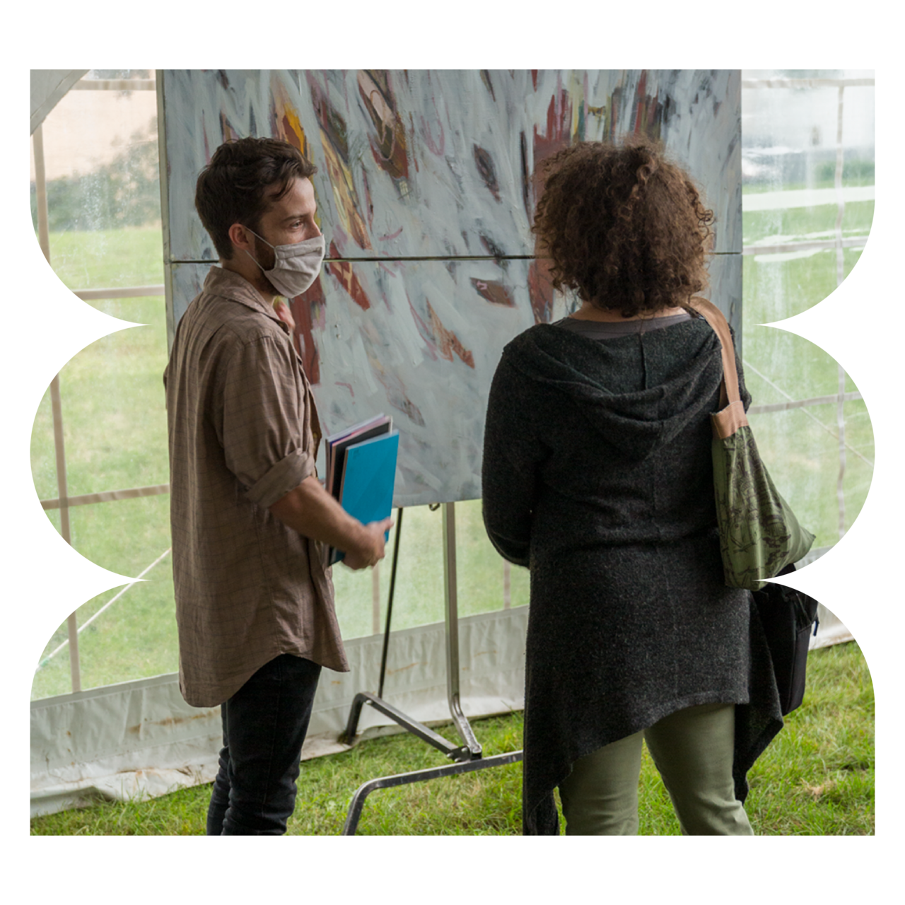 Two students speaking about a piece of art