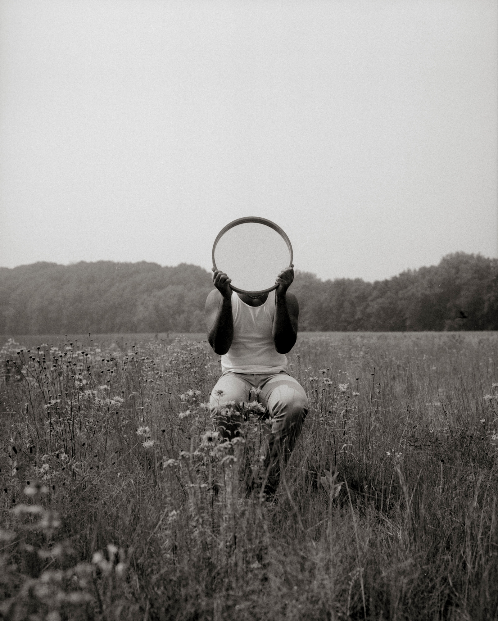 Person sitting in a field