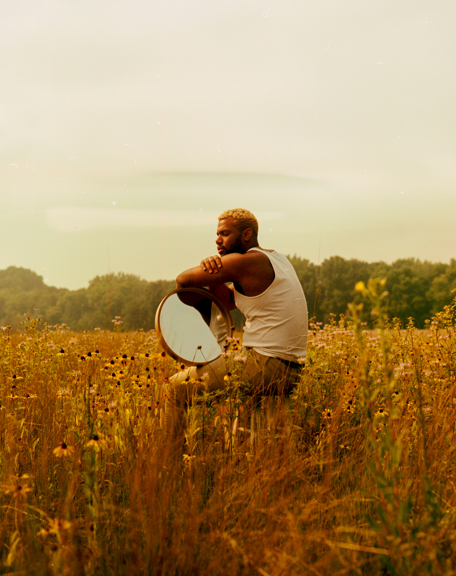 Photo of a person sitting in a field