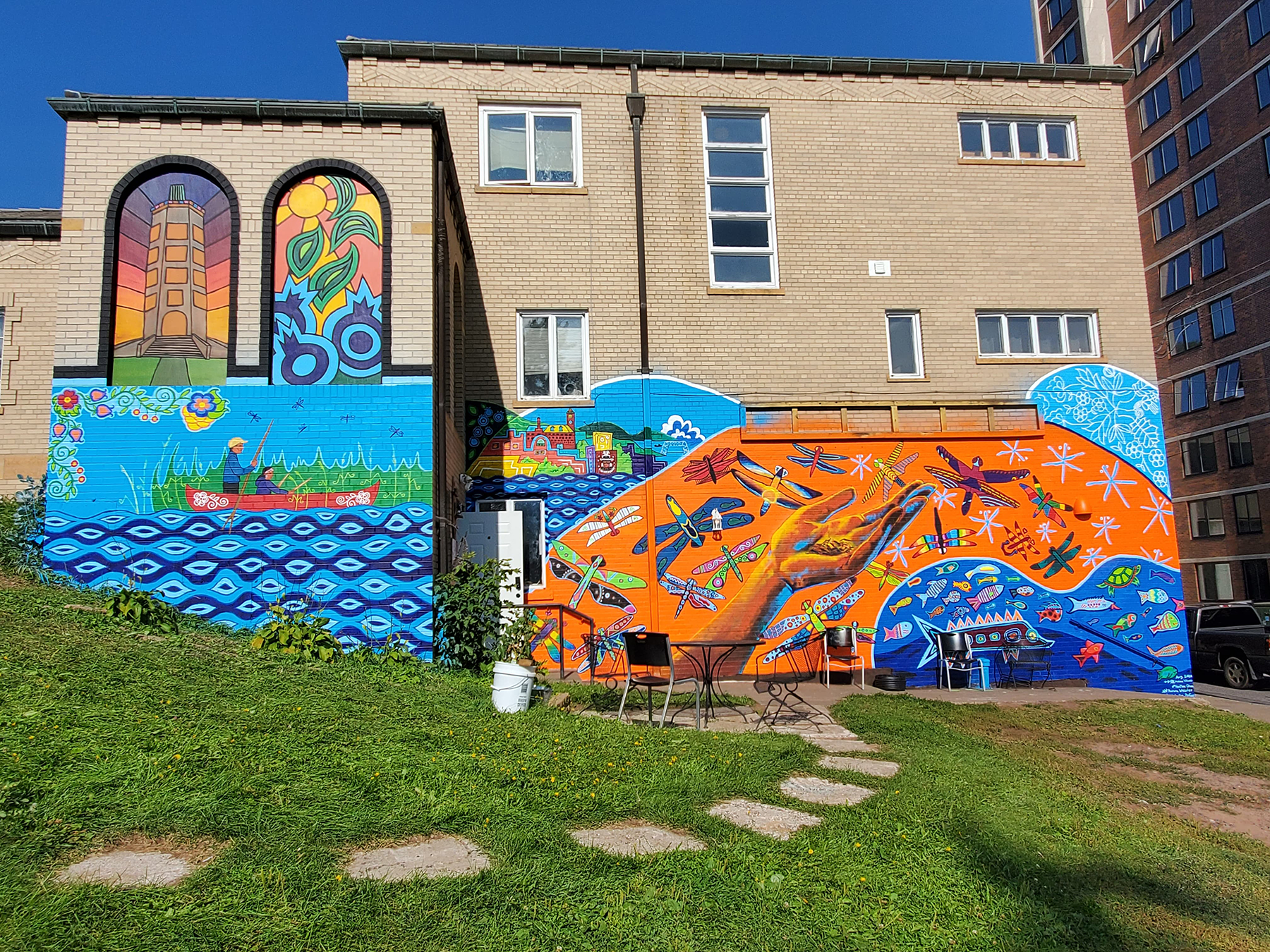 An image of a mural painted alongside a building.