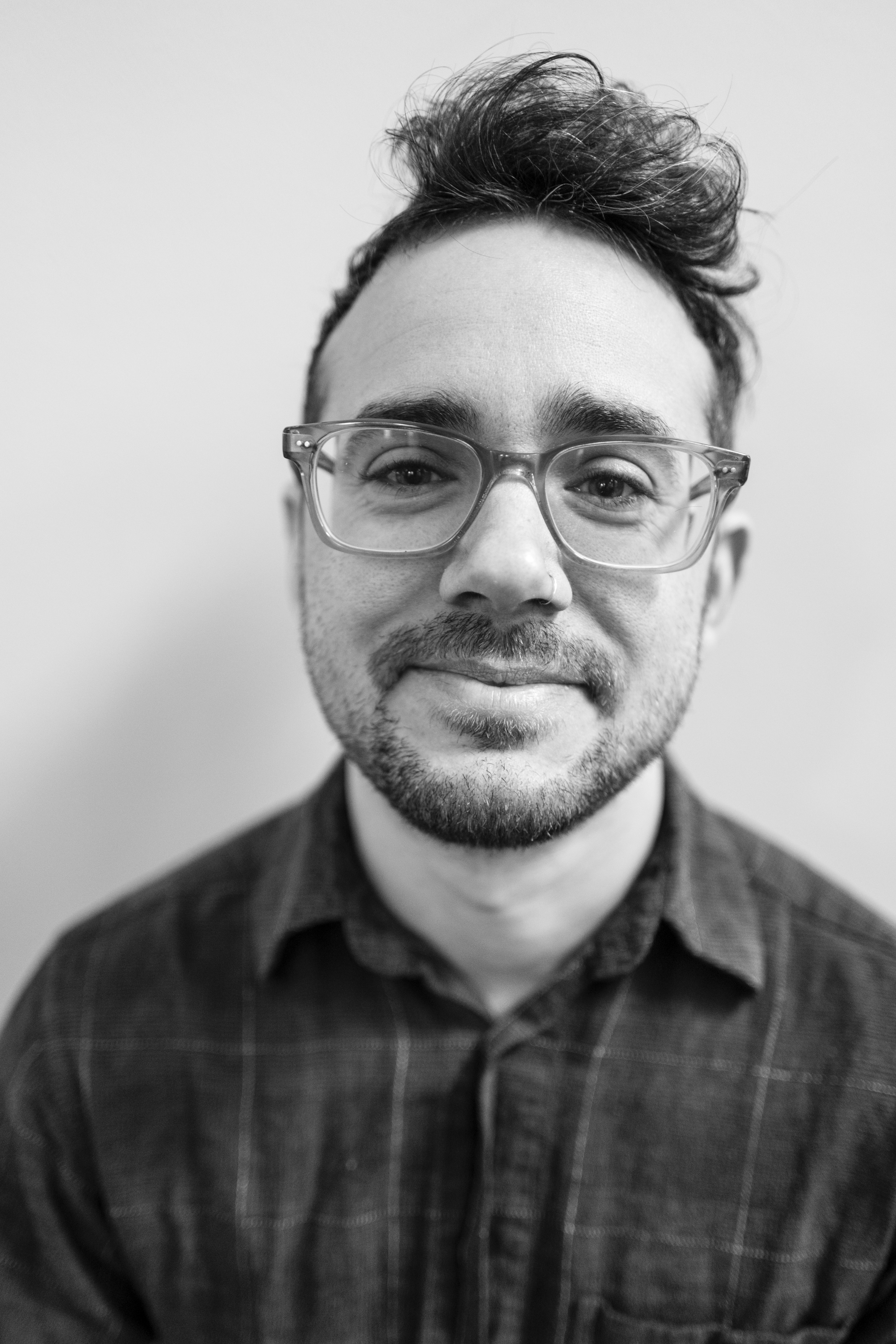 MFA Mentor Image Eli Brown, black and white headshot of an MCAD MFA Mentor