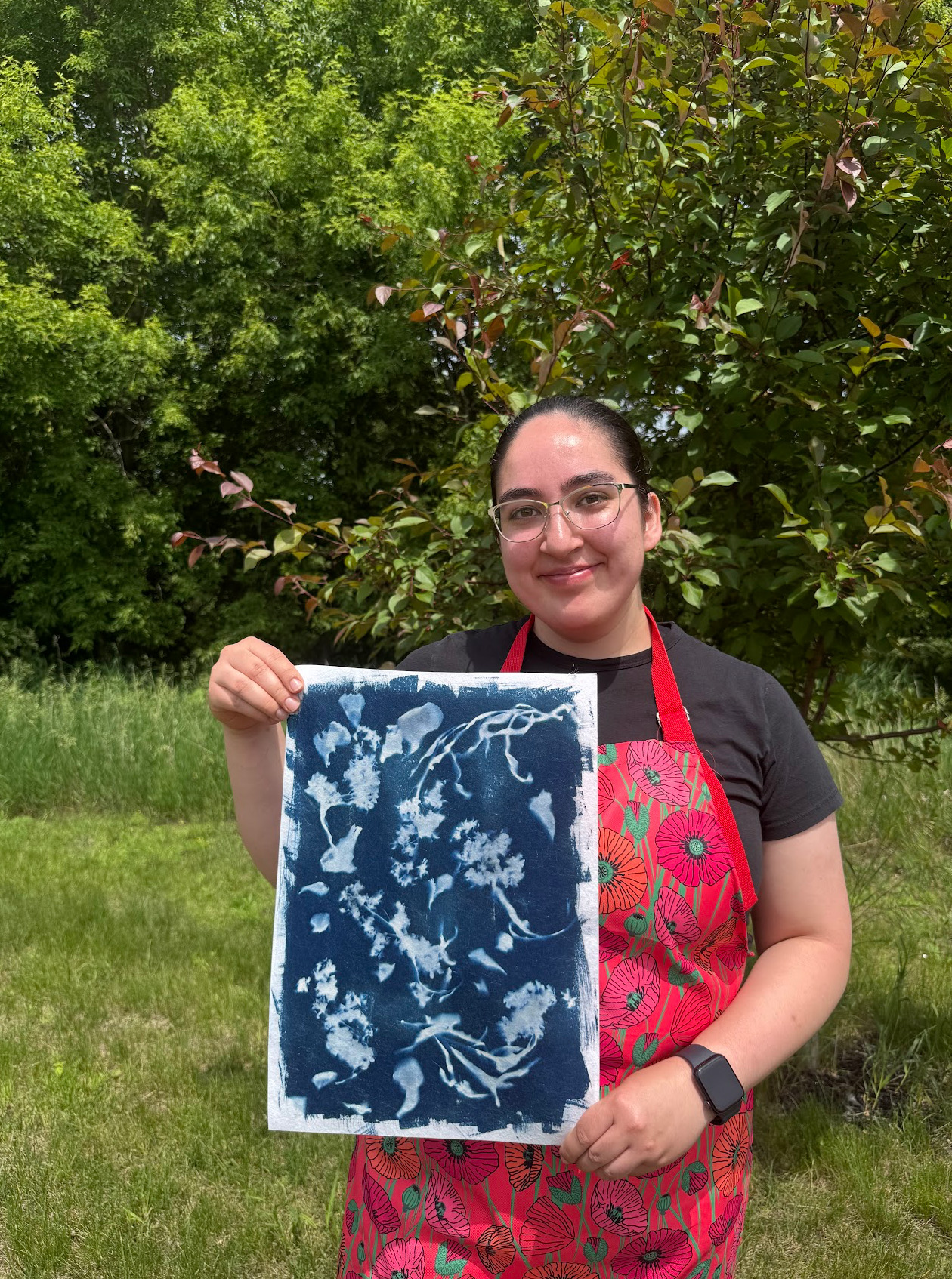 DeAnda and some of her work while on site at Art in Motion 