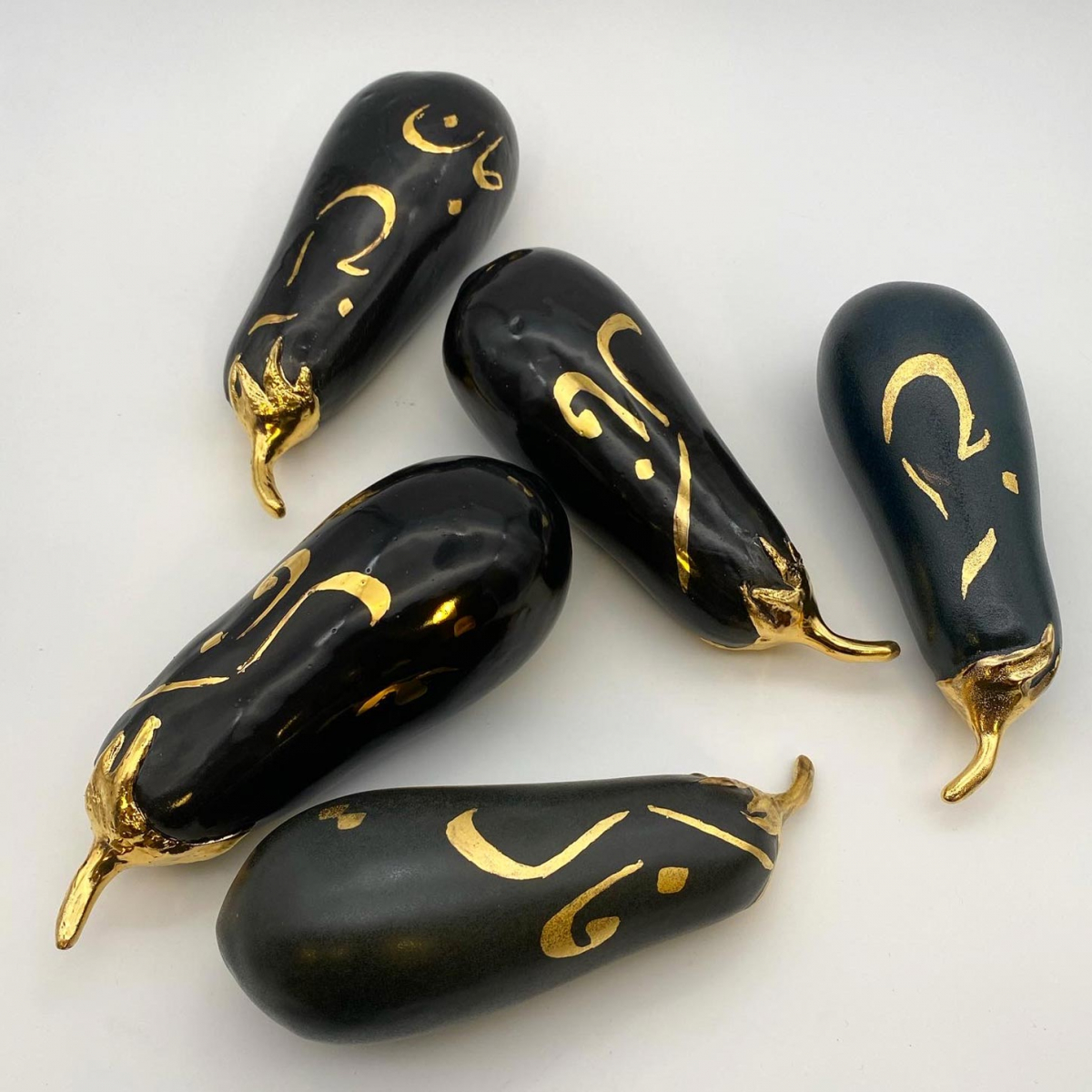 Black and gold eggplant sculpture