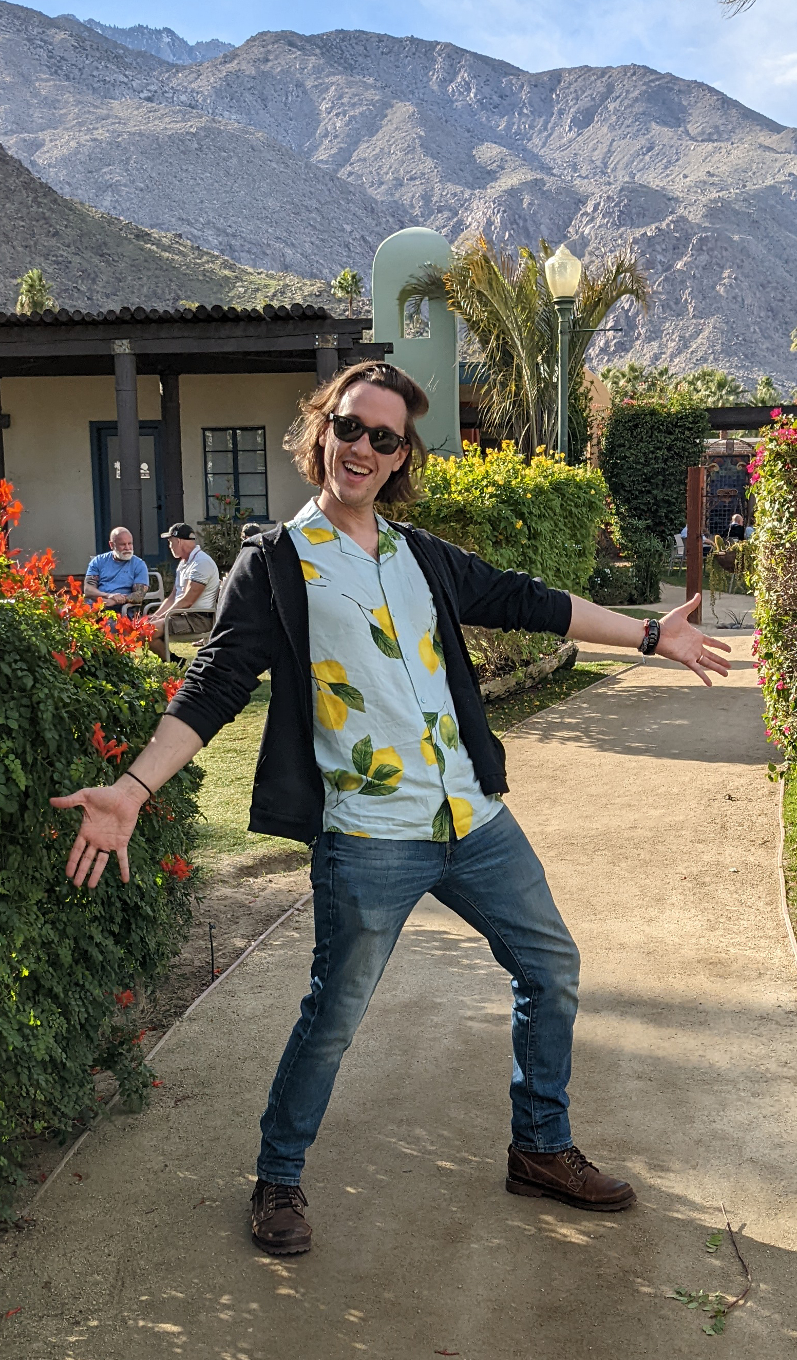MFA Mentor Image Brock Brown, person standing outdoors with a mountain-scape in the background