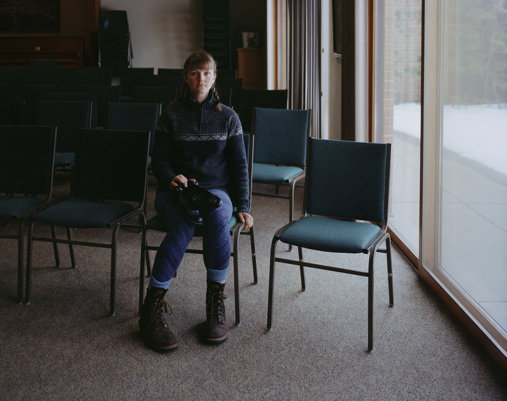 Photo of a person sitting in a chair