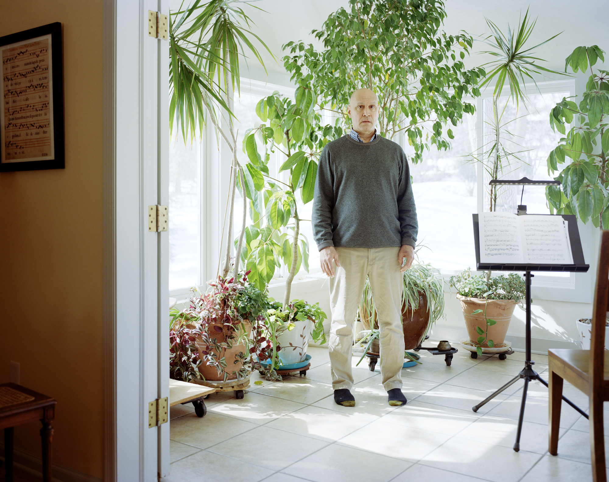 Person standing with plants