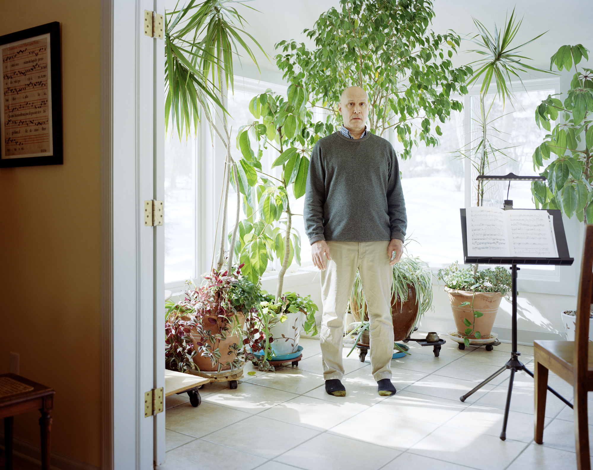 Person standing with plants