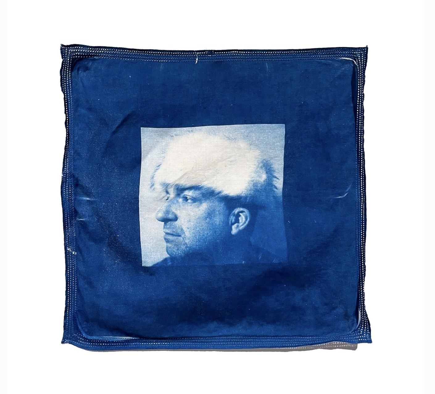 Square pillow with cyanotype of male bust 