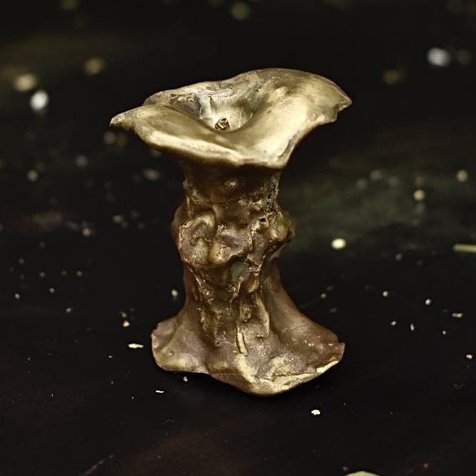 Bronze sculpture of an apple core