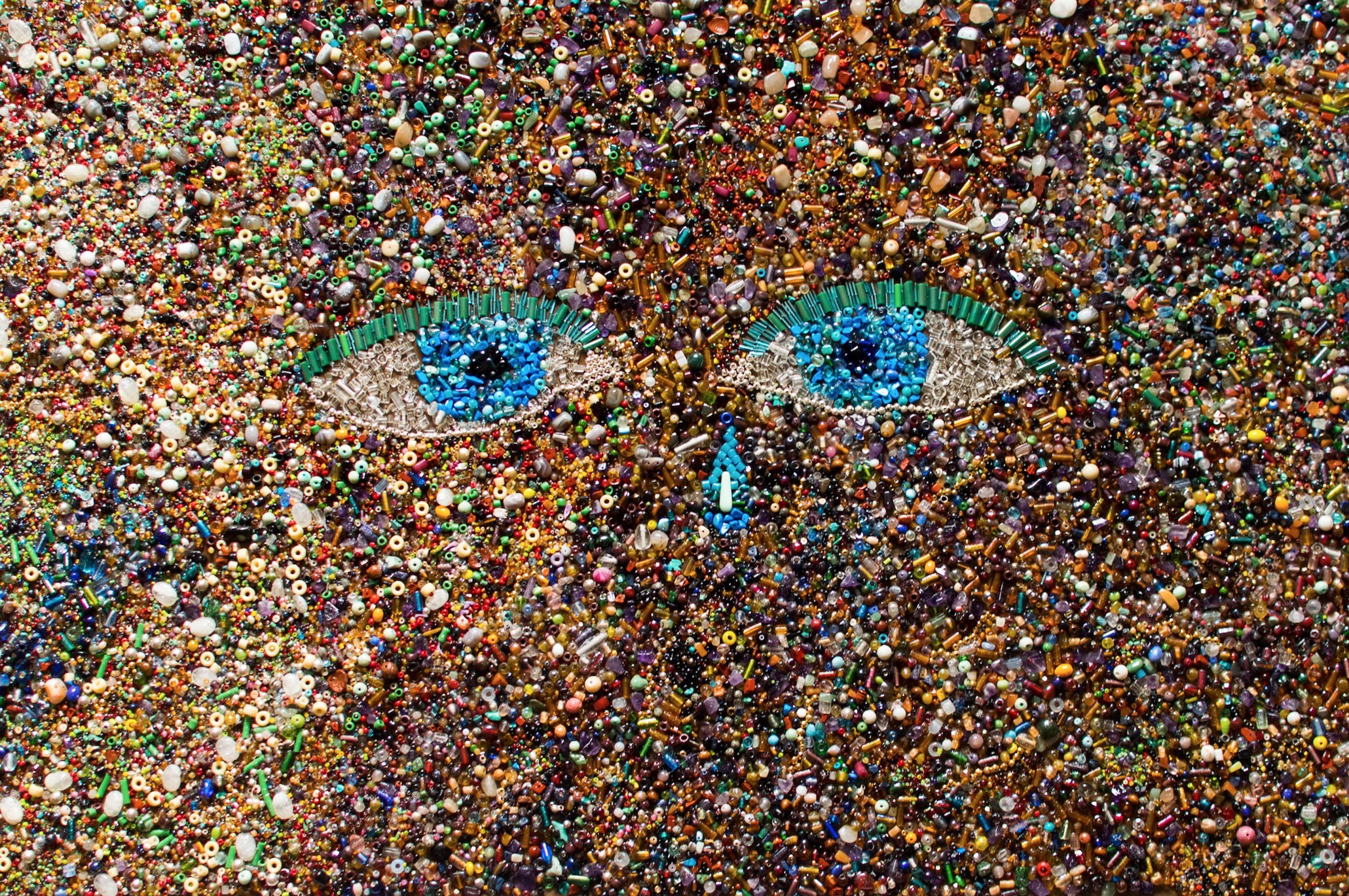 Multimedia textural image of blue eyes staring back at the viewer.