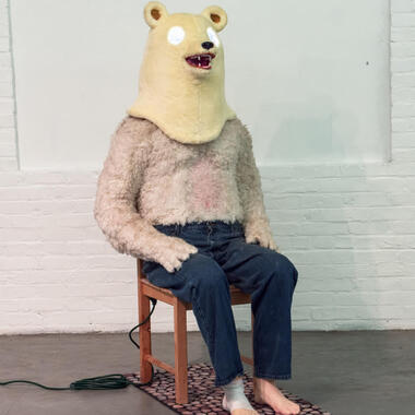 Raina Belleau, The Oracle, 2016, acrylic paint, apoxie sculpt, bandage, chair, door mat, electrical components, extension cord, faux fur, jeans, LEDs, mirror, paper mache, plaster and spray paint, 60 x 24 x 42 inches