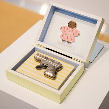 Renne Stout, Baby's First Gun, 1998.   Mixed Media.