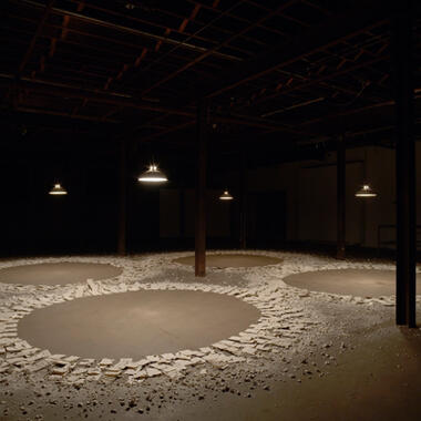 Lauren Herzak-Bauman, Memory Eternal, 2009, porcelain, vintage light fixtures, incandescent bulbs, 20’h x 24’w x 24’ d.