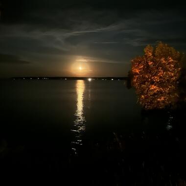 moonrise over a lake with fall foliage