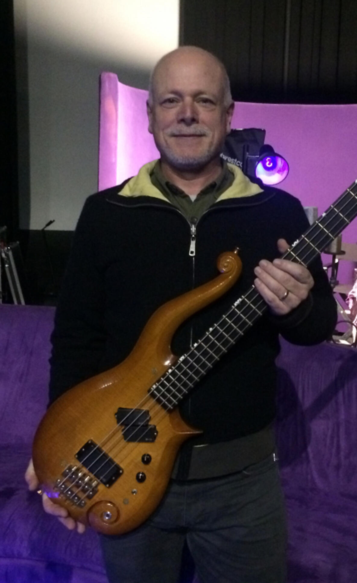 Gerald Ronning holding one of Prince's guitars