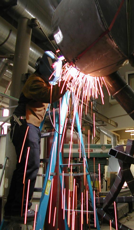 Person welding their sculpture