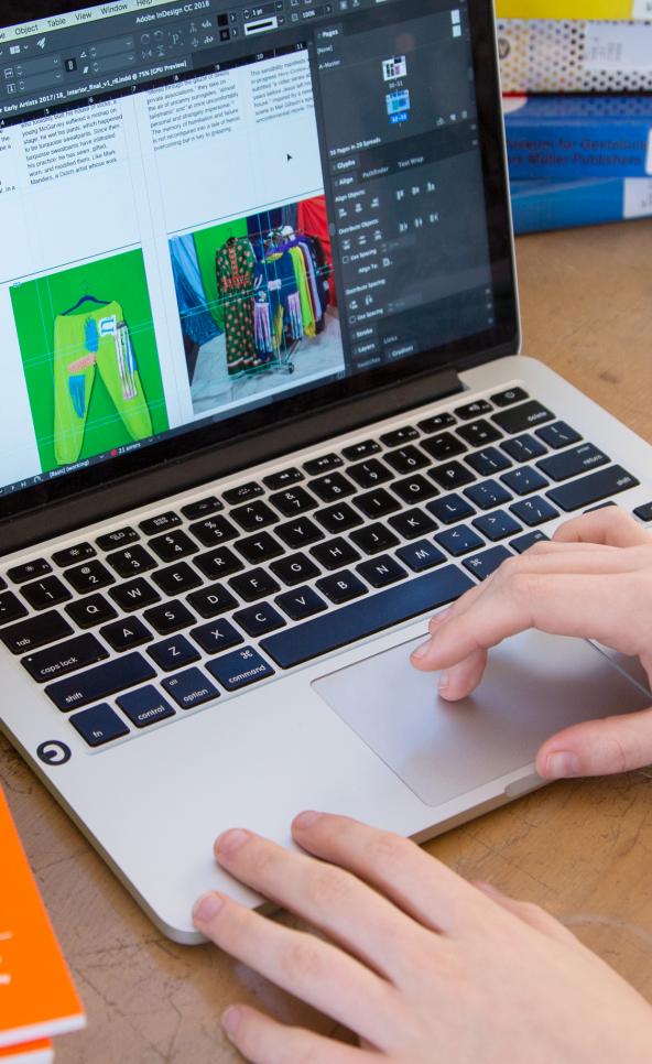 Close up of someone working on their laptop