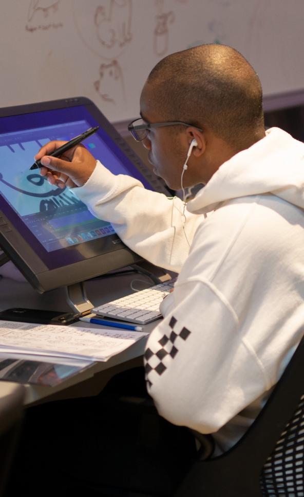 Student working on a wacom cintiq tablet in the animation studio