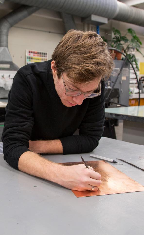 Student working on intaglio