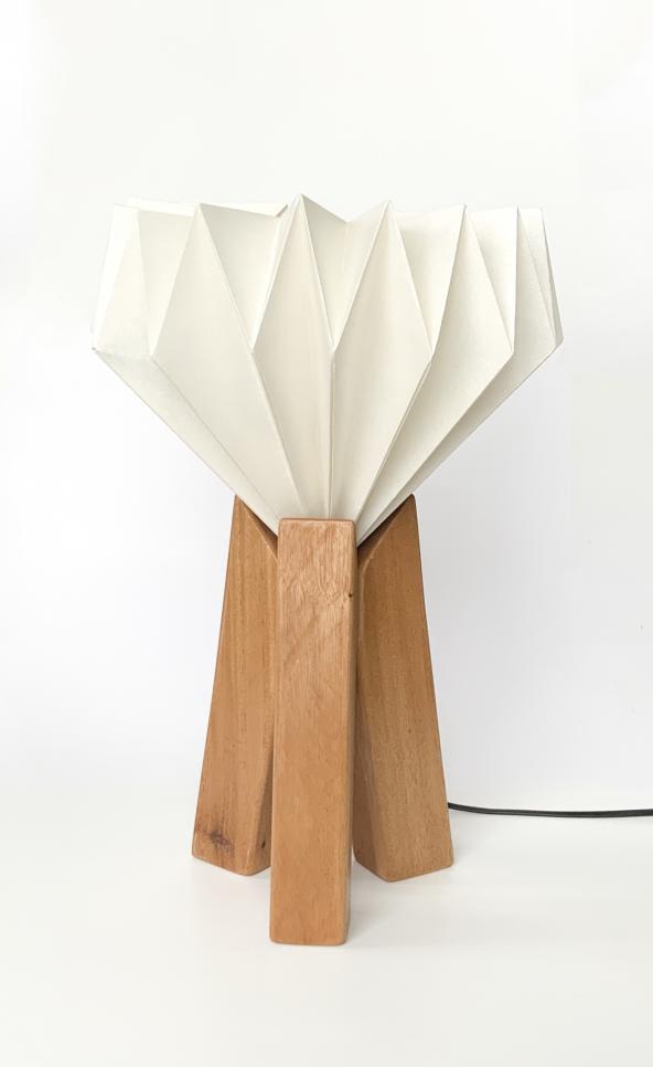 Innovative lamp design focusing on three wooden pillars. ; Zachary Wegscheid