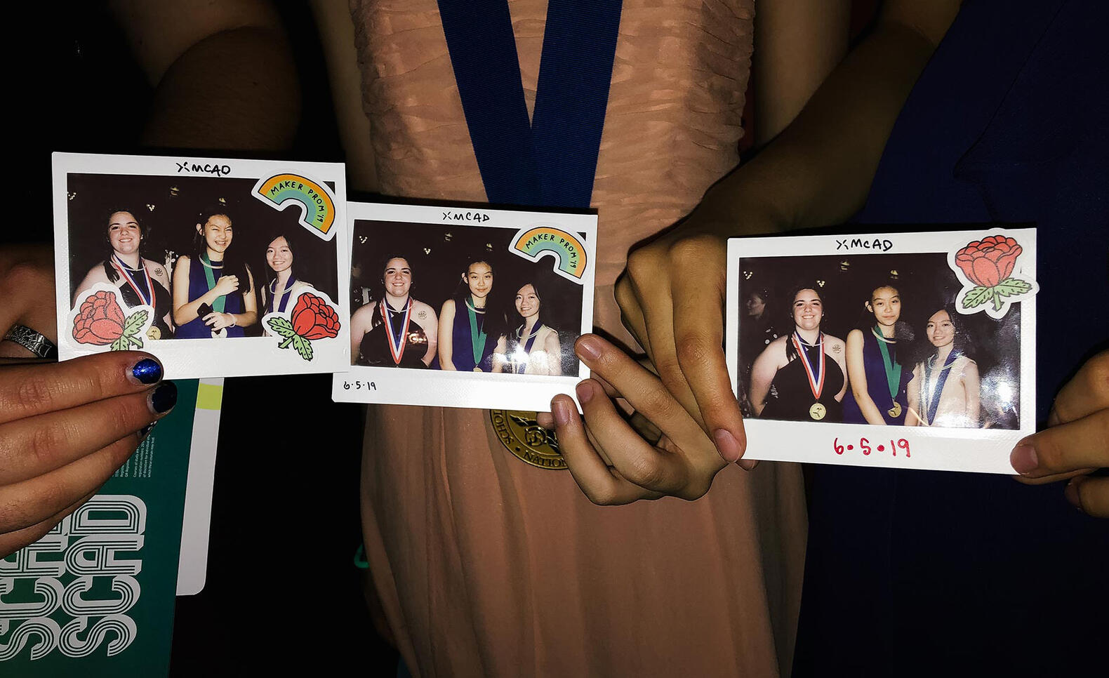 Prospective students showing off their Polaroids at the AICAD Maker Prom. Photo by Forrest Wasko.