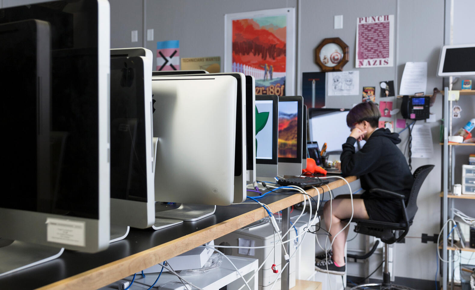 Person at desk working on computer