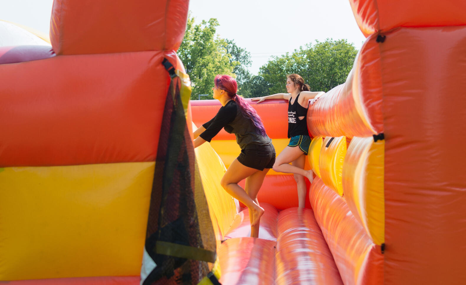 Students in a bouncy castle