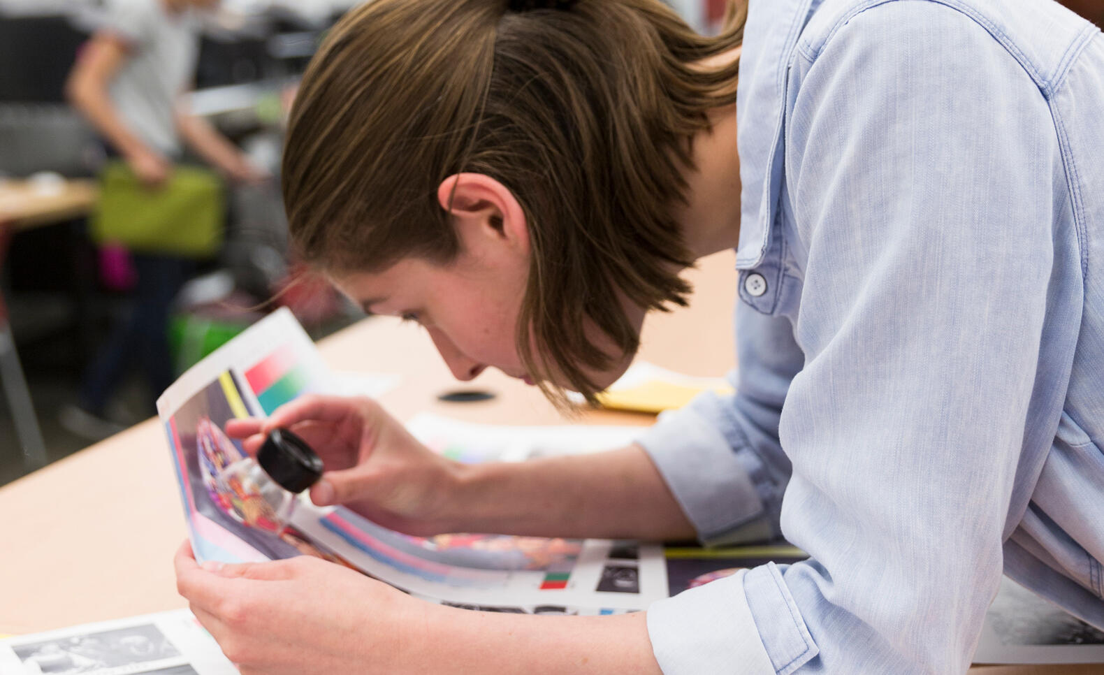 Person looking at print color up close