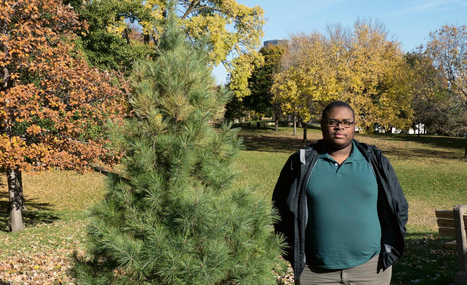 Student standing in a park
