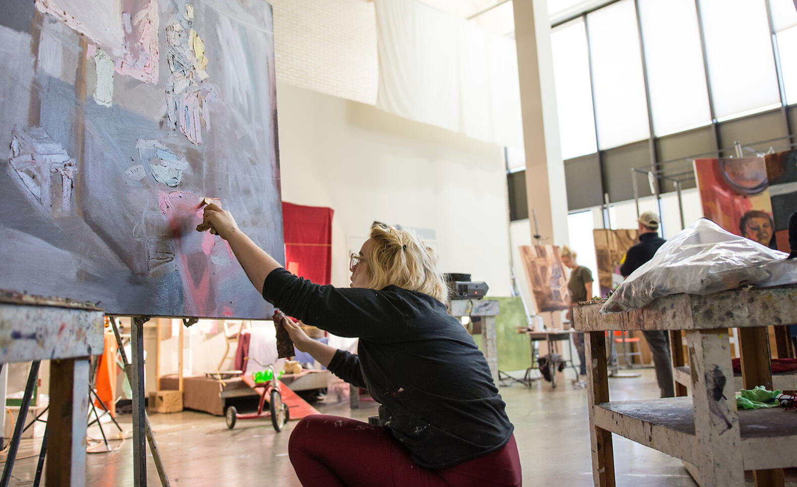 Student working on a painting