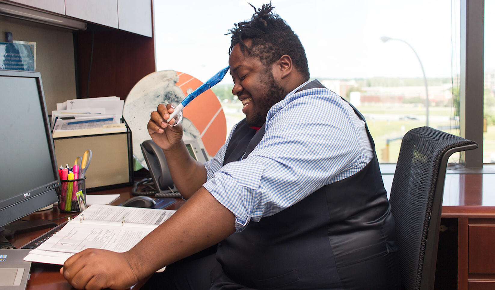 Person sitting at their desk