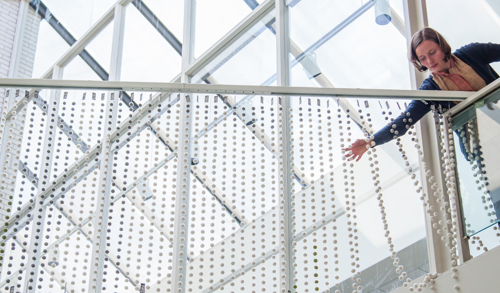 Alum and faculty member Arlene Birt installing her piece