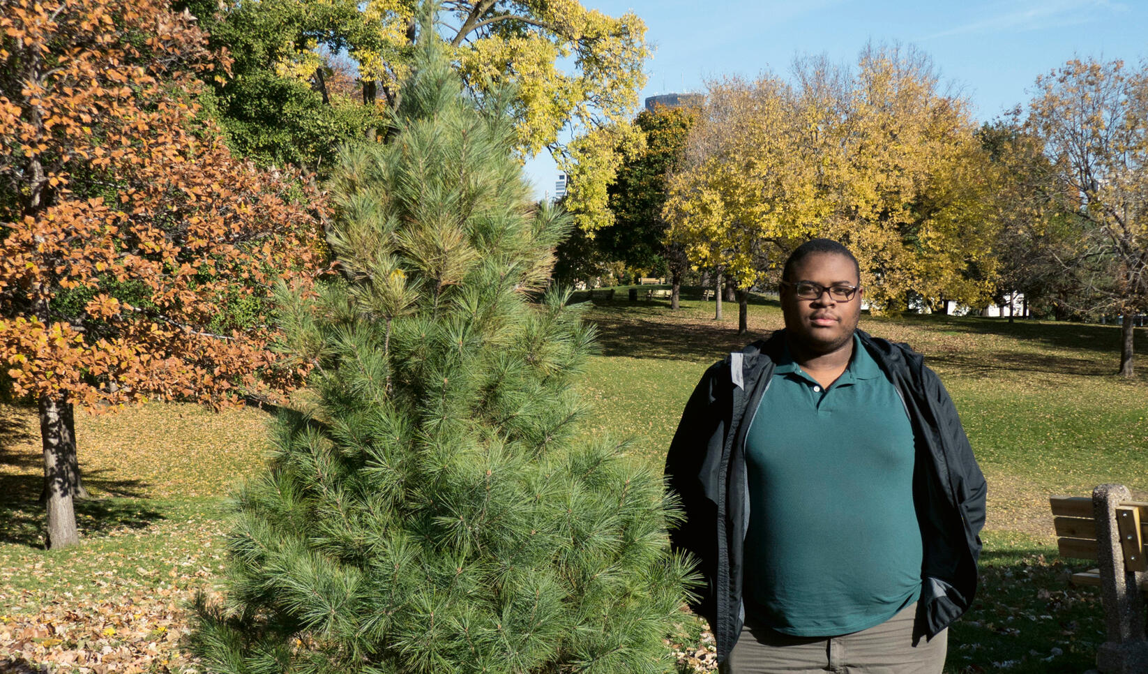 Student standing in a park