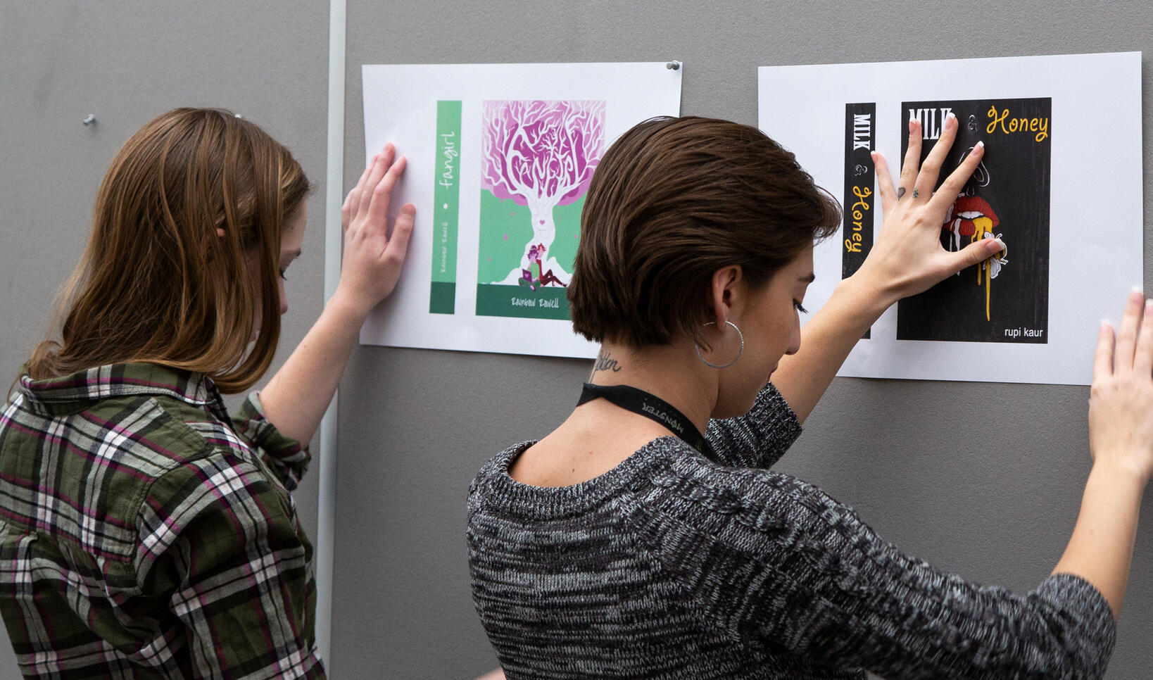 Students hanging up their illustrations