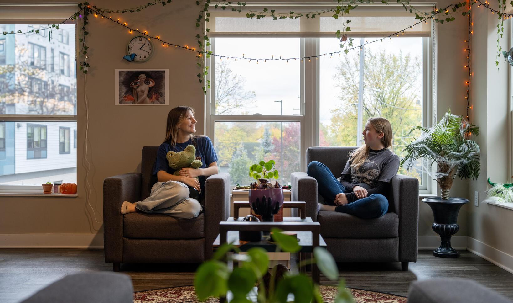 dorm photoshoot header image for admitted student page how to pay, two students in an mcad dorm room 