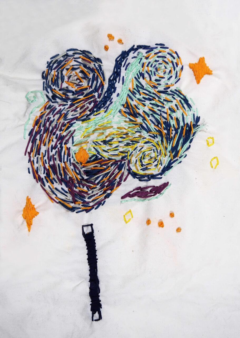 A colorful embroidered abstract piece