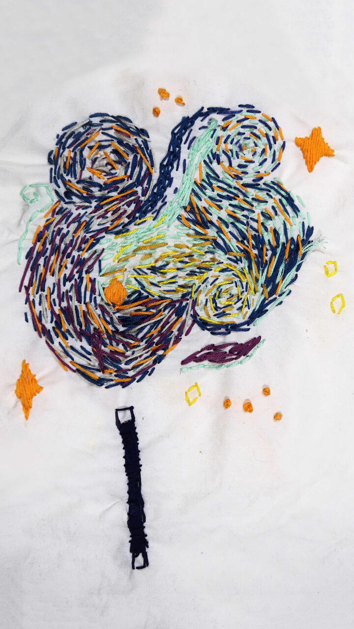 A colorful embroidered abstract piece