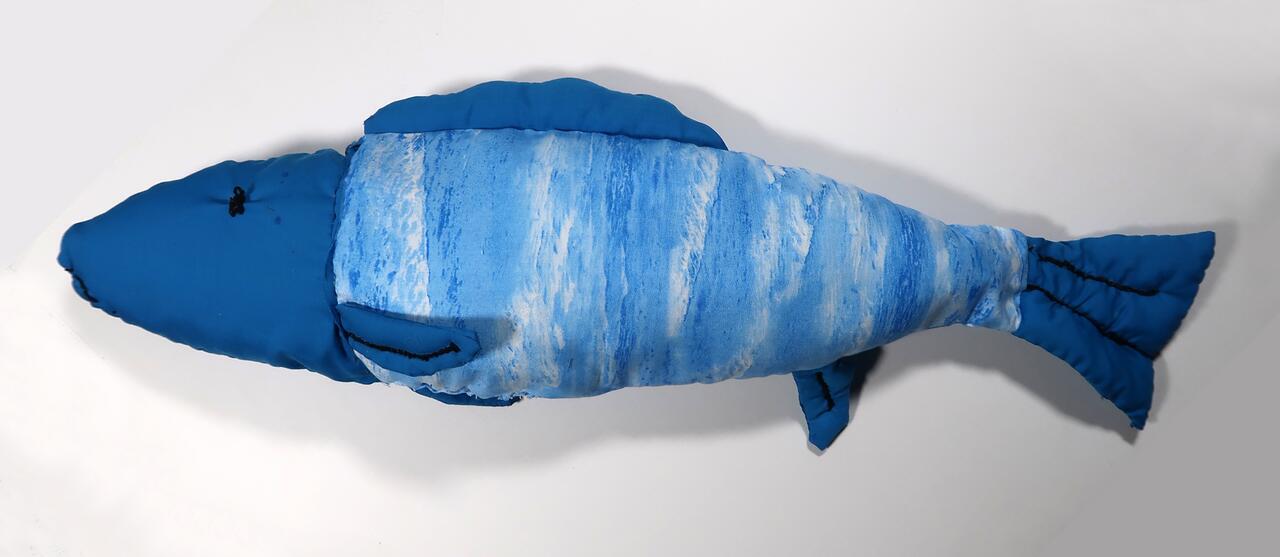 Soft sculpture composed of various blues and textures.