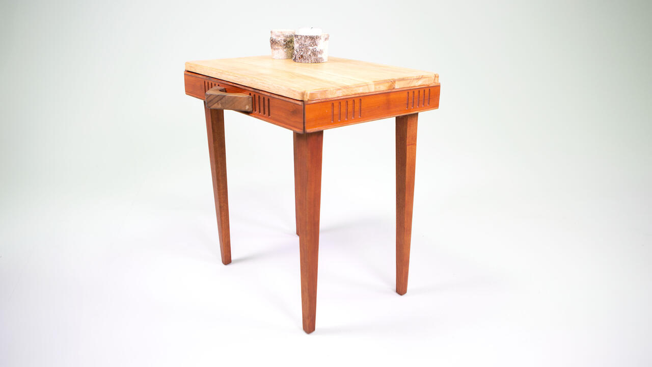 A wooden chess table with a drawer