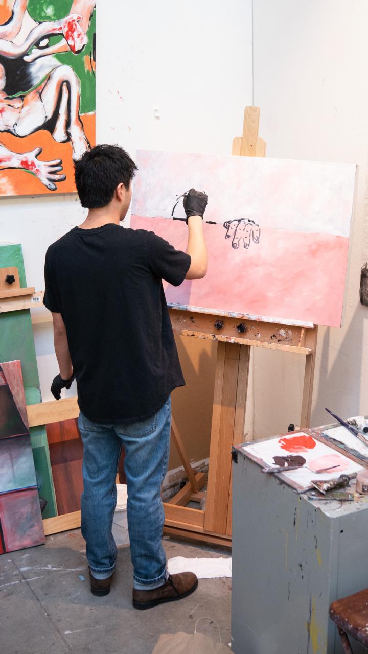 Person painting in their studio