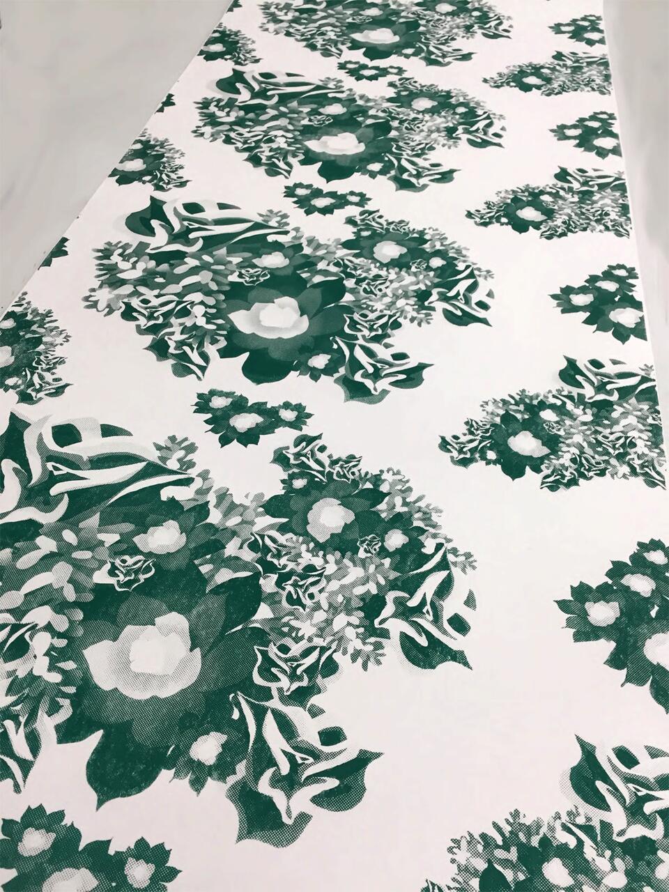 Printed Wallpaper featuring florals in different shades of green.