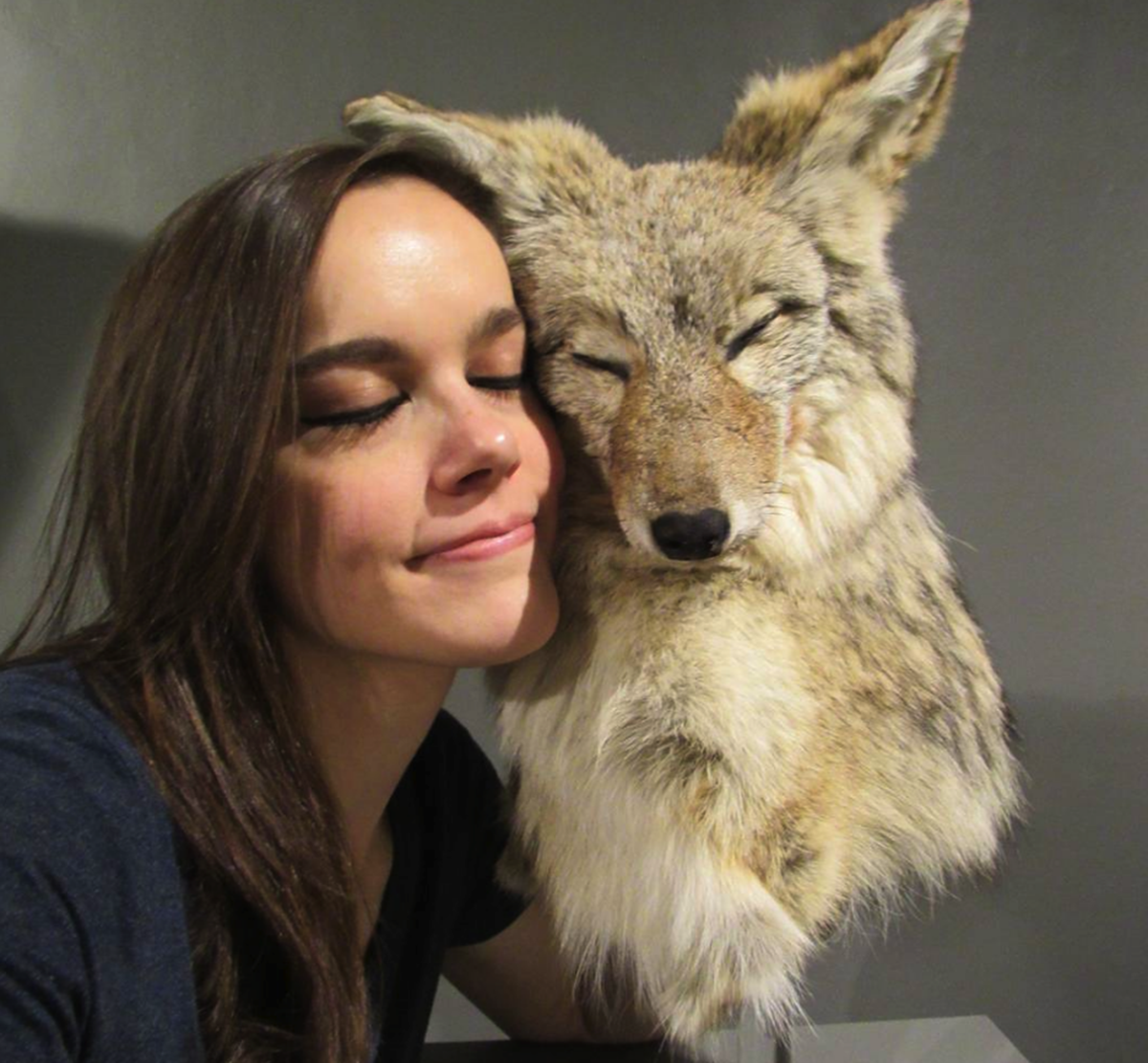 Maggie Falco in front of a faux fox sculpture