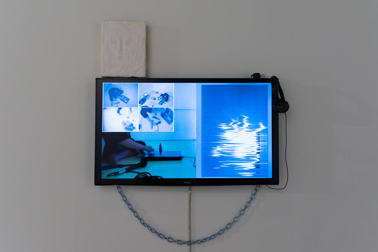 Installation of video rendered in shades of blue.