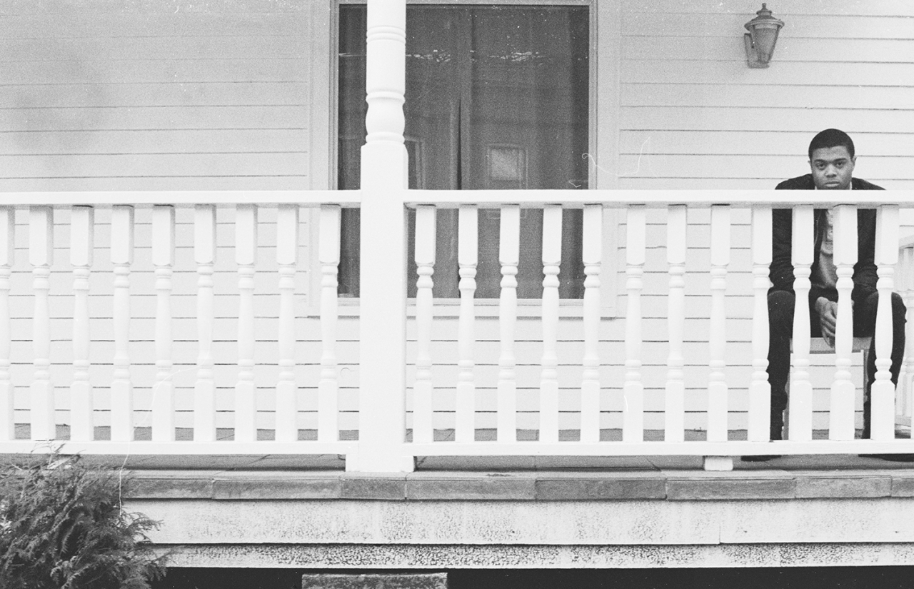 Grayscale photography series featuring single figures in different urban environments.